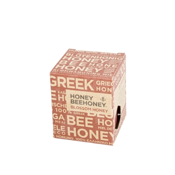 Light and Floral Blossom Honey from Greek Meadows Golden Blossom Honey drizzled on fresh bread, showcasing its light floral texture.