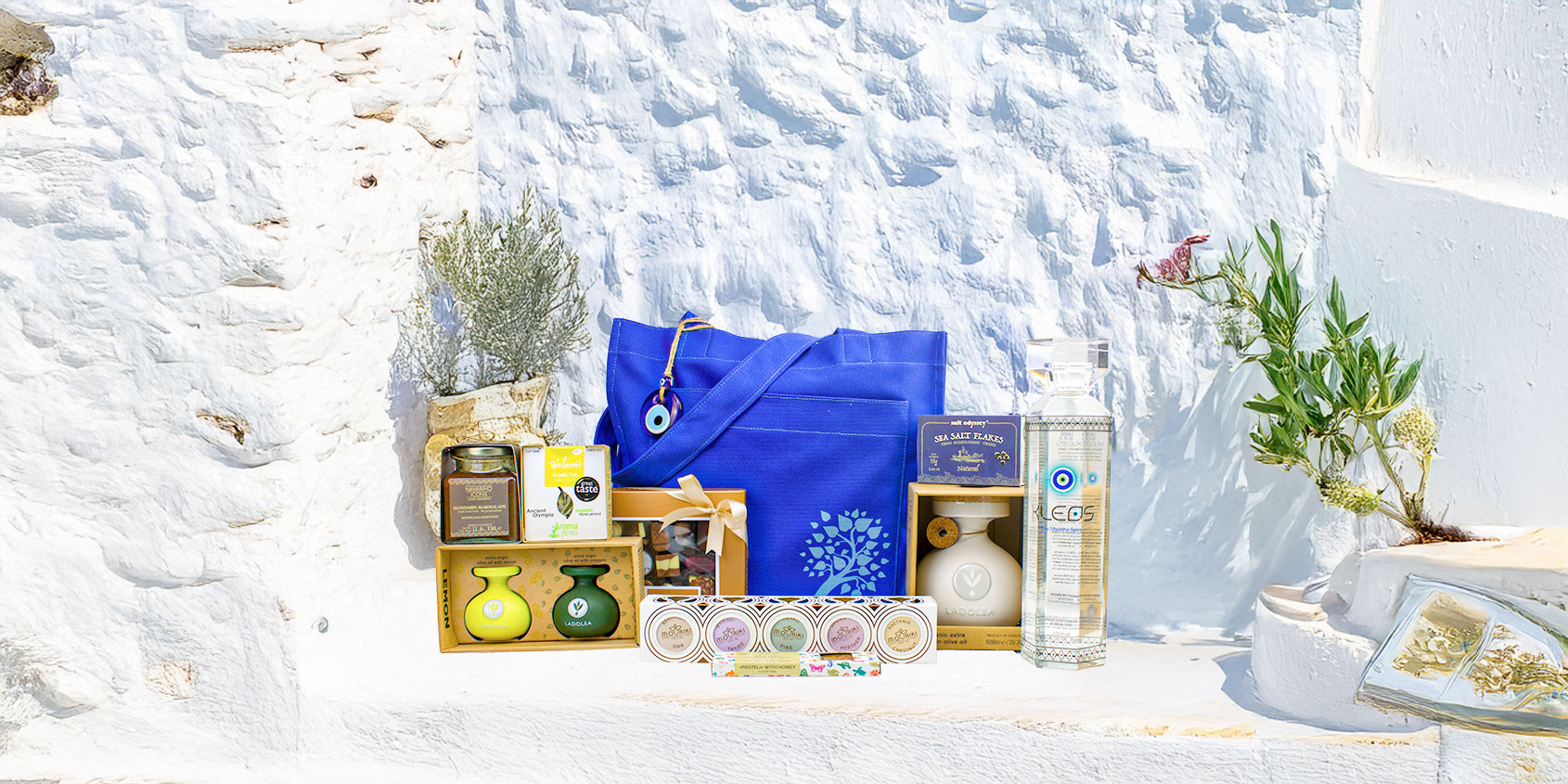 Grekisk lyxpresentkorg med hantverksmässig olivolja, honung och gourmetgodis i en premiumpresentask