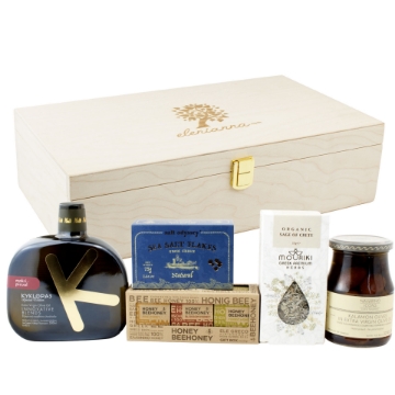 Authentic Greek Gift Set with Wooden Keepsake Box Greek gift box with artisan olive oil, organic oregano, Kalamon olives, and sea salt flakes arranged beside a luxury wooden box