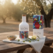ALÓNI 'The Grove' Limited Edition EVOO bottle with collectible art by Greek artist Soteur shown next to its matching gift box
