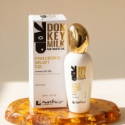 Luxury Greek skincare Mastic Spa eye gel on stone with mastic resin and yellow herbs representing natural ingredients and Chios origin.